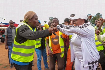 Machakos Governor Wavinya Ndeti greets a youth at Nguluni in Matungulu Sub-county during the launch of a county government programme to train 3,000 youths in motor vehicle driving and e-commerce
