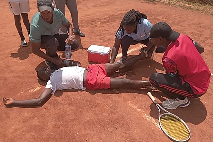 Jeff Okuku celebrates in pain after winning the Eastern African singles title in the 16 years old and under category
