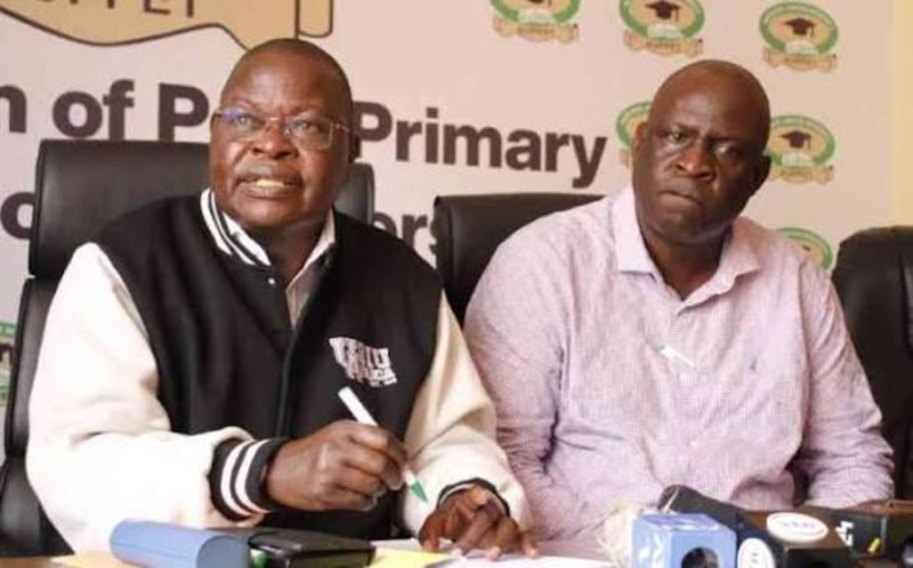 KUPPET Secretary-General Akello Misori (left) and chairman Omboko Milemba