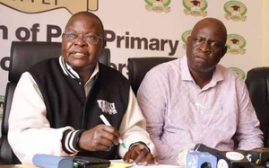 KUPPET Secretary-General Akello Misori (left) and chairman Omboko Milemba