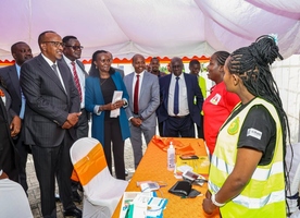 A health worker briefs Health Cabinet Secretary Aden Duale on the TB situation in the country