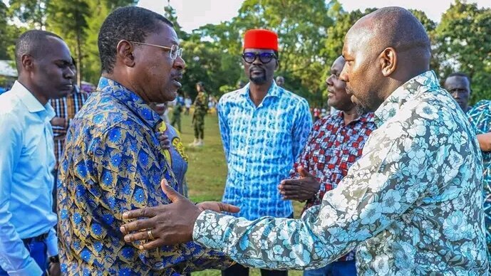 National Assembly Speaker Moses Wetang'ula (left) welcomes Interior Cabinet Secretary Kipchumba Murkomen at their home in Mukhweya village, Kabuchai, Bungoma County. Mr Murkomen condoled with the family following the passing on of their mother--Mama Annah Nanyama Wetang'ula.