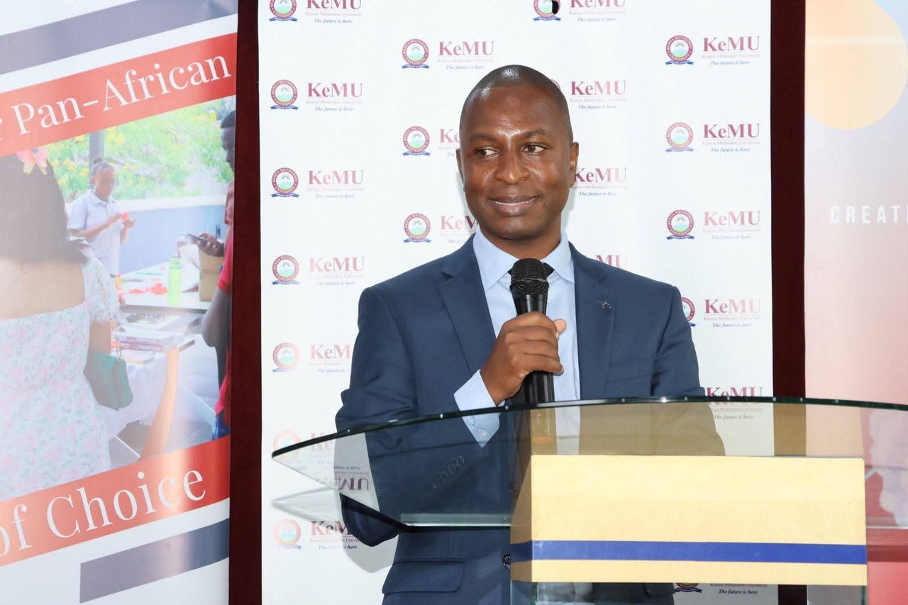 Dr Bundi Karau addressing the audience during the launch of his memoir Escort-in-Chief at KeMU