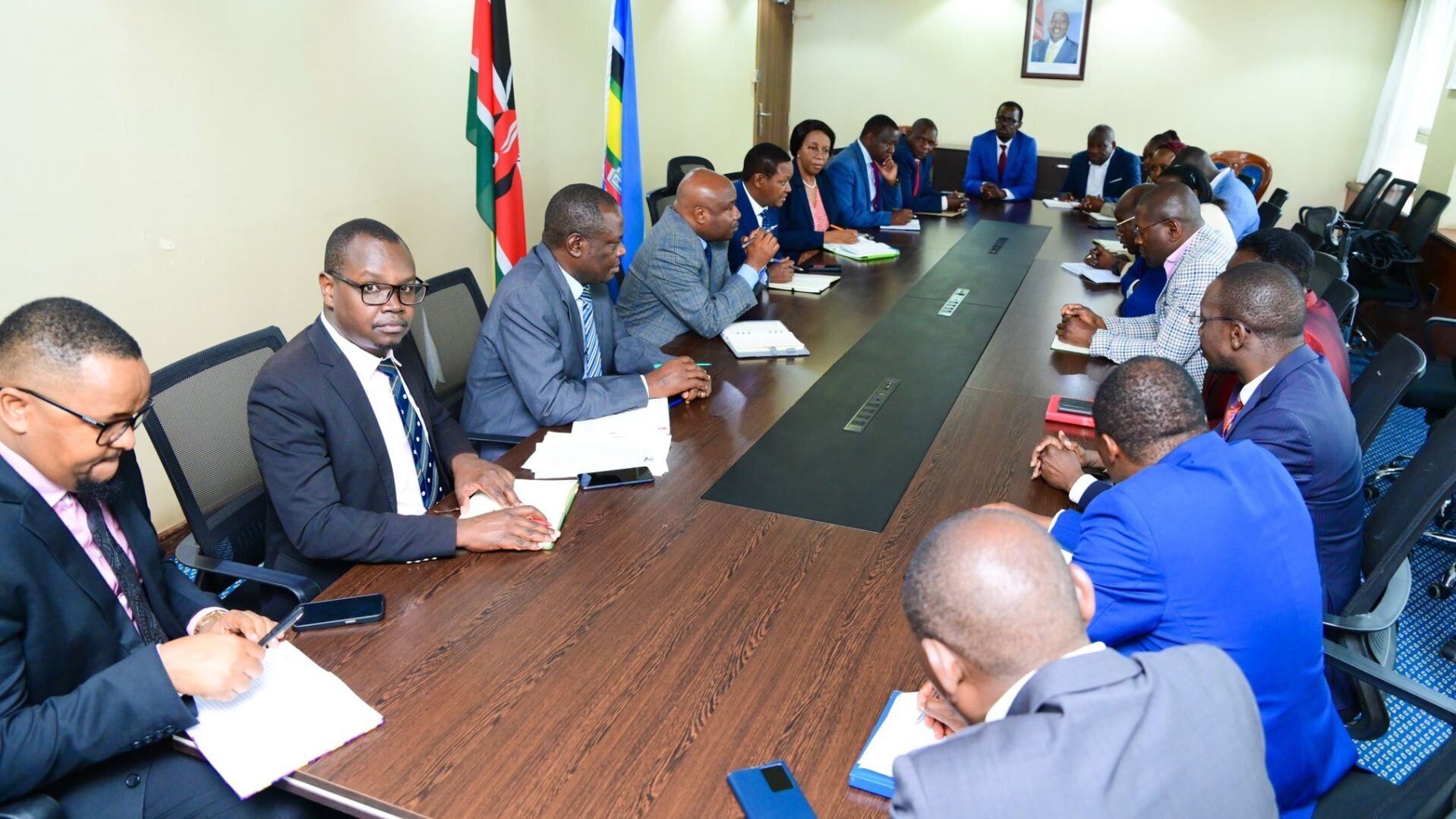 Alfred Mutua with varsity dons