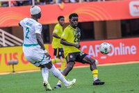 Senegal's Seyni Ndiaye shoots the ball past Ugandan player during their CHAN 2024 quarter-final match
