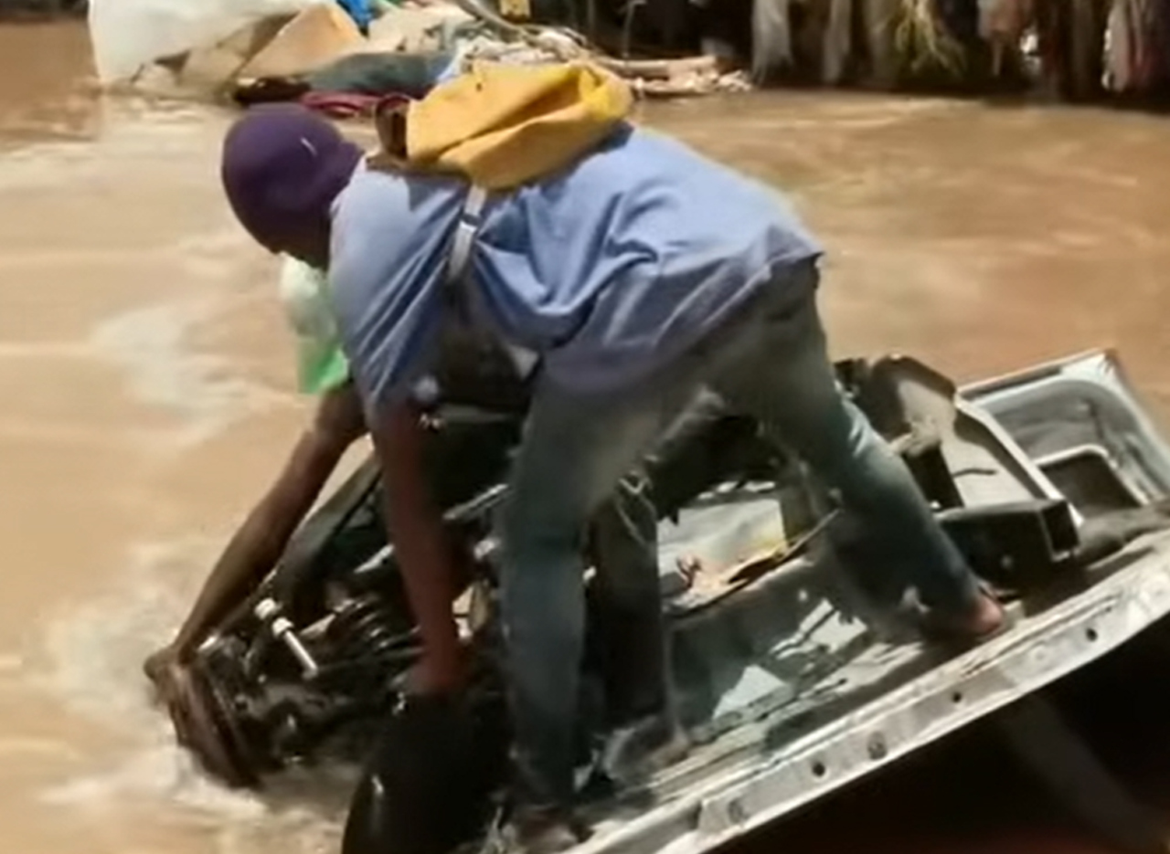 Car swept by flood water