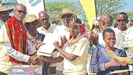 Some of the women who graduated with certificates in artisanry under the Ujuzi Manyattani Vocational Training Programme in Laisamis town, Marsabit County. Here they receive awards from organisers of the programme.