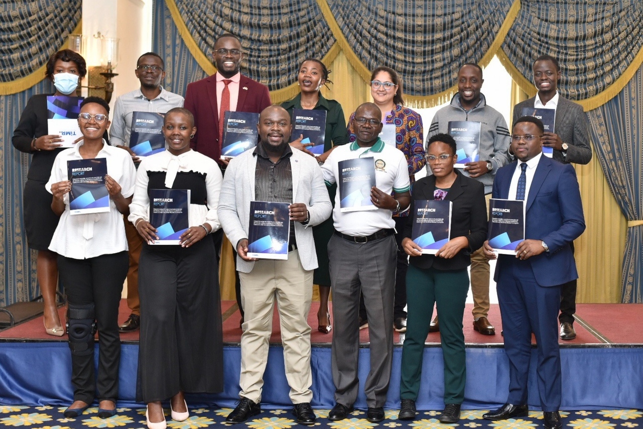 Officials display copies of the tobacco marketing study during a briefing on youth exposure to nicotine products at the Sarova Stanley hotel in Nairobi