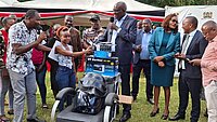 Some of the beneficiaries of the MSEA programme get a machine from director General Mwenda Rithaa (in googles) in Meru