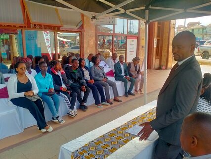 Equity Bank Tala Branch Manager, Mr Stephen Mutua, speaking during the flagging-off ceremony for beneficiaries in Tala town. He noted that the beneficiaries were top-performing students who achieved A and A- grades in their KCSE examinations