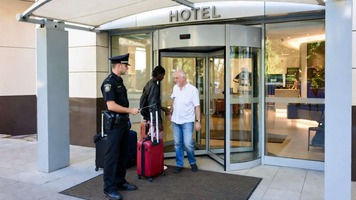 High Court rules security checks at hotels are not discriminatory or humiliating