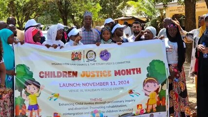 Judiciary and child protection officials with some children