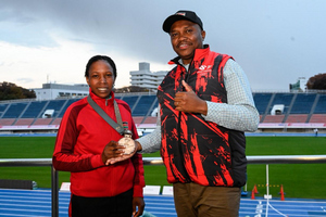Kenya's Serah Kimani Wangari with Sports PS Elijah Mwangi