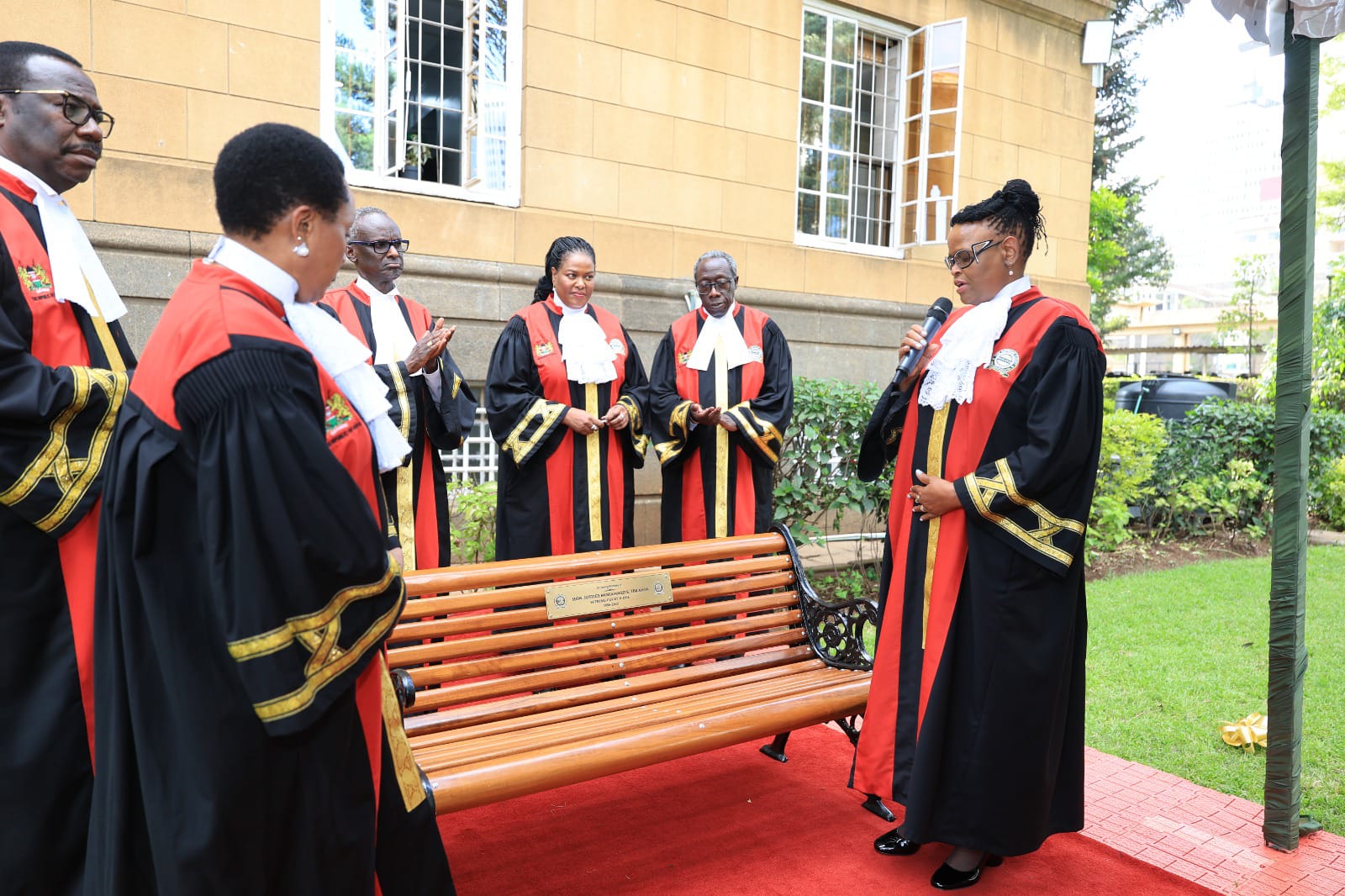 Chief Justice Martha Koome and the Judges of the Supreme Court unveil a commemorative bench in honour of the late Justice Mohammed Ibrahim.