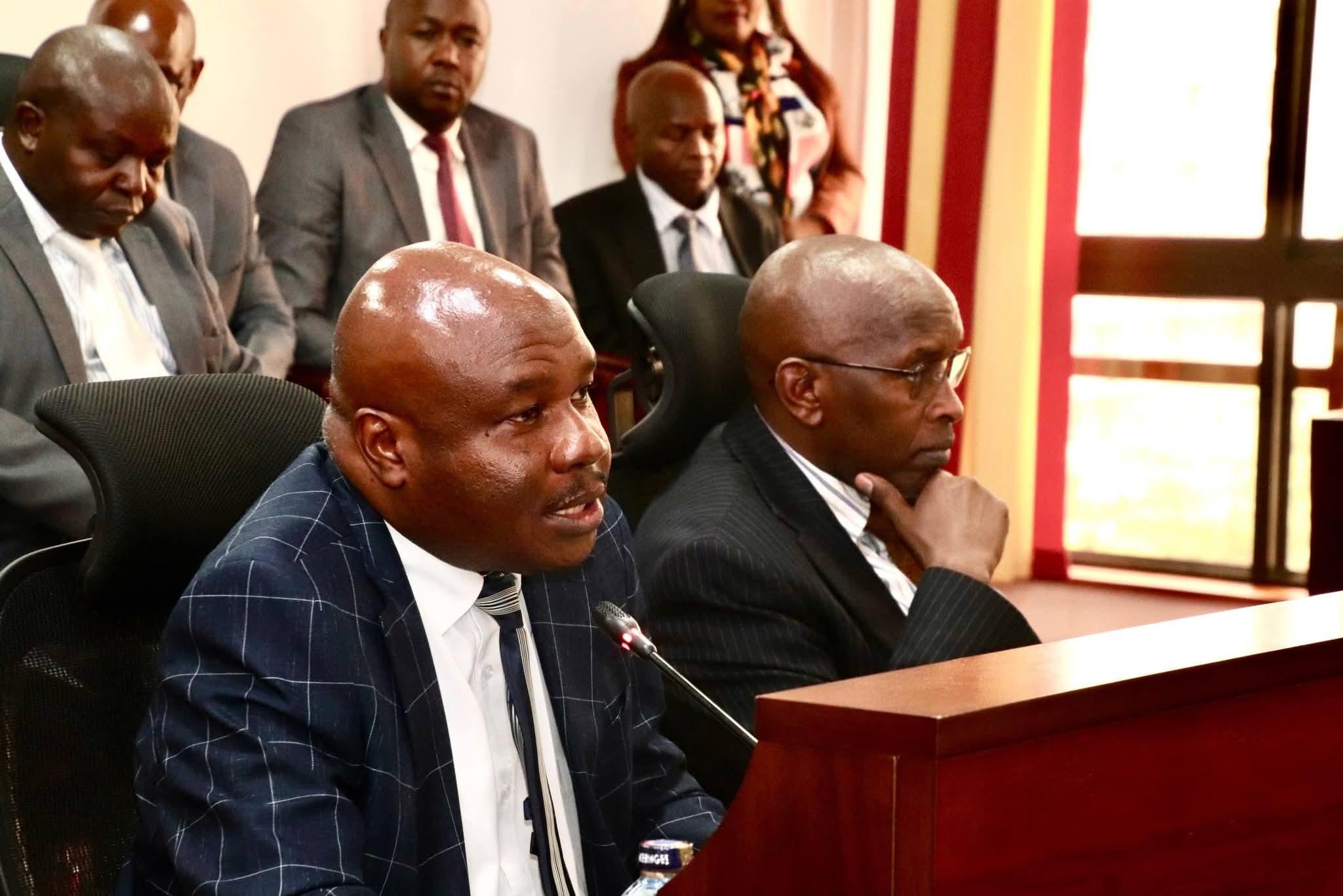 Principal Secretary in the Stated Department of Labour and Skills Development Shadrack Mwadime (front, left) speaks when he appeared before the National Assembly Departmental Committee on Labour